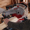 mitering crown molding with a miter saw to attach to the cocktail hutch