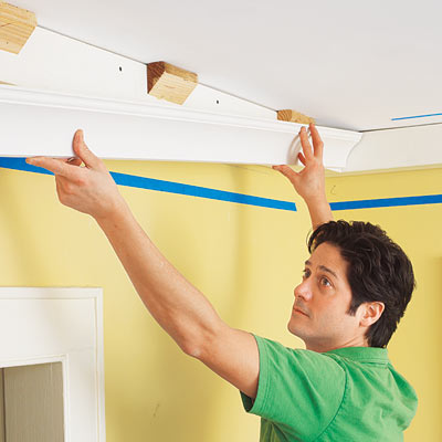 installing the first run of three-piece crown molding