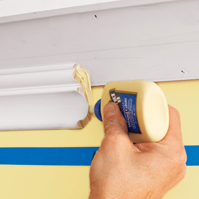 applying glue to a scarf joint to attach to three-piece crown molding