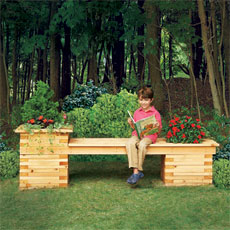 child enjoying a seat on an outdoor planter bench on a beautiful day