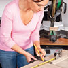 measuring the door to mark the trim cutlines