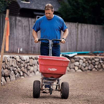Roger Cook rototills the soil