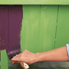 applying a top coat of purple paint over faux crackle for a kitchen island