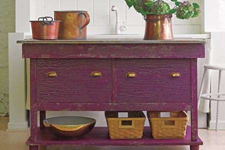 a kitchen island with faux crackle