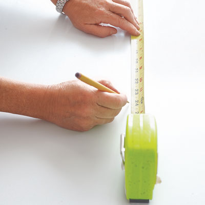 finding the center point of a table surface with a tape measure