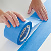 laying the second row of painter's tape on a table surface