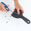 cutting notches in a plastic putty knife for the combing tool