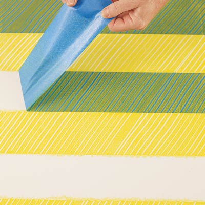 removing the tape from the first coat