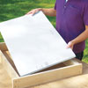 Mark Powers cuts foam for hypertufa table insulation with a utility knife