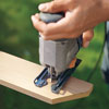 Mark Powers cuts notches into the crosspiece boards for the structure of the hypertufa table with a jigsaw