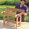 Mark Powers places the stretchers over the notches of the hypertufa table crosspieces