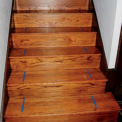 painter's tape used to mark the stairs to center the easy to install stair runner