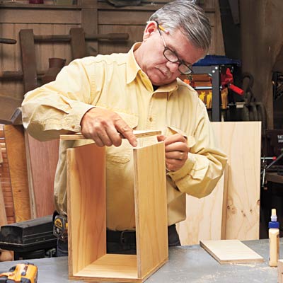 Tom Silva assembles a cubby for a hutch