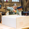 Tom Silva adds the header to the bookcase