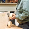Tom Silva adds the feet to the bottom corners of the bookcase