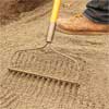 rake used to lay the leveling sand to build a stone planter