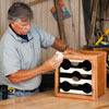 Tom Silva sands the completed wine rack