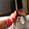 removing cabinet door with work gloves