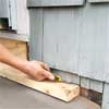 trim the shingles to clad concrete steps in stone
