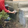 add the scratch coat to clad concrete steps in stone