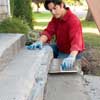 lay the mortar bed to clad concrete steps in stone