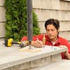 person marking porch post location