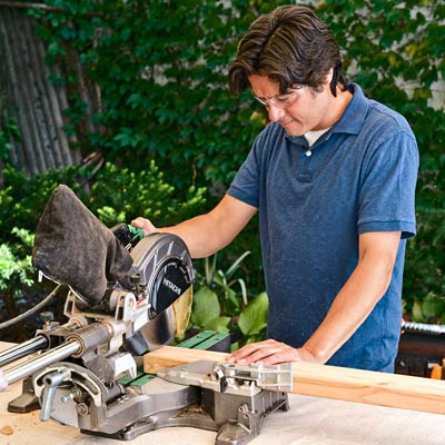 cutting a 2x4 with a compound miter saw