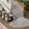 unloading gravel into a new driveway for the base layer