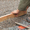 screeding the gravel to keep it flat for a new driveway