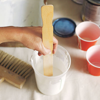stirring the glaze with a stir stick