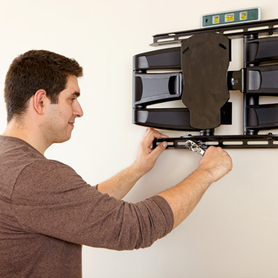 installing wall mount for hanging a flat-screen tv