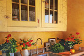 yellow crackled painted kitchen cabinets with painted hinges