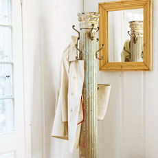 a coat rack made from a salvaged antique column