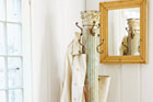 a coat rack made from a salvaged antique column