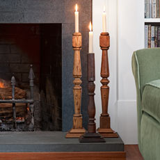 candlesticks made from balustrades in living room on fireplace hearth