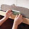 photo of upper-field tile being set in place