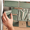 photo of tiles being set in place with cardboard spacers