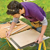 Using a framing square, draw two perpendicular lines on the plywood