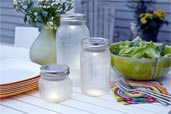 Make Solar Lanterns From Mason Jars on an outdoor table