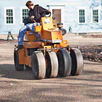 Roll the Surface Install a Low-Maintenance, All-Gravel Driveway