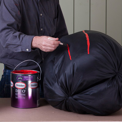 attach nylon bags to wood frame for giant yard halloween spider