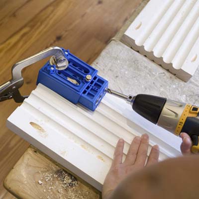Join the pilasters to the plinths by driving in screws on back of wood members