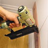 Image of a nail gun attaching cedar to the wall