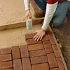 filling in the field to build a brick path