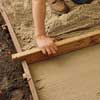 add the sand layer to make a brick path