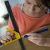woman doing markings on shutters