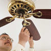 attaching the blades and lights to a ceiling fan