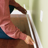 Attach molding to baseboards
