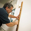 Tom Silva hanging wallpaper