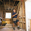 measuring the studs for a partition wall